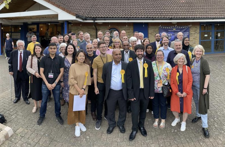 Setting out a vision and executing a plan, JK led the team to their best ever local election results. JK stands within a group of newly elected councillors, as well as volunteers, after the 2022 local elections in Kingston upon Thames.
